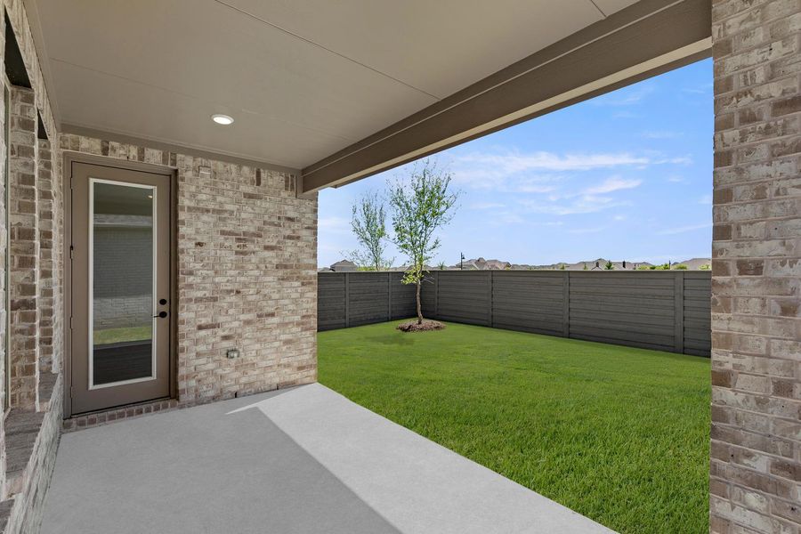 Exterior details and patio area of a home in Union Park, Little Elm (Image 20).