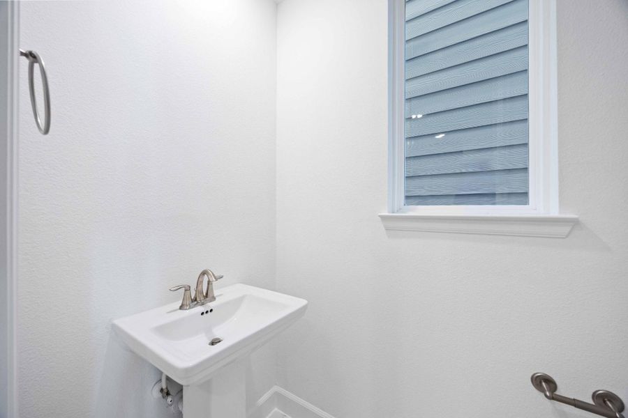 First-floor powder bath — convenient for guests and tucked away from the main living area.
