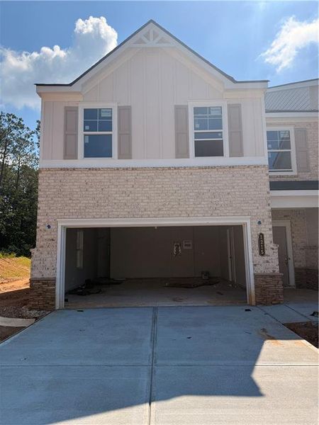 Front exterior of a new home in Park Center Pointe, Mableton, GA, highlighting curb appeal (Image 2). Front exterior of a new home in Park Center Pointe, Mableton, GA, highlighting curb appeal (Image 2).