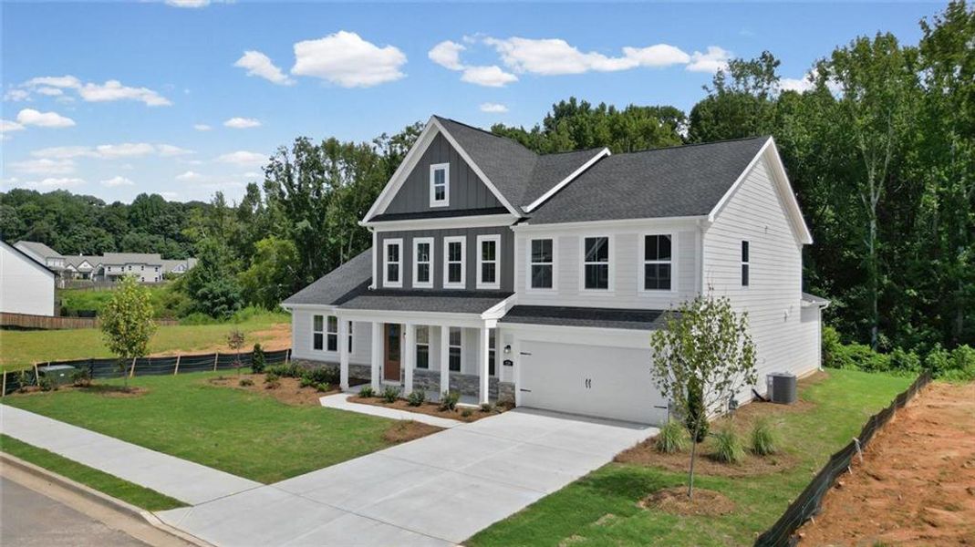 Front exterior of a new home in Hidden Fields, Hoschton, GA, highlighting curb appeal (Image 21).