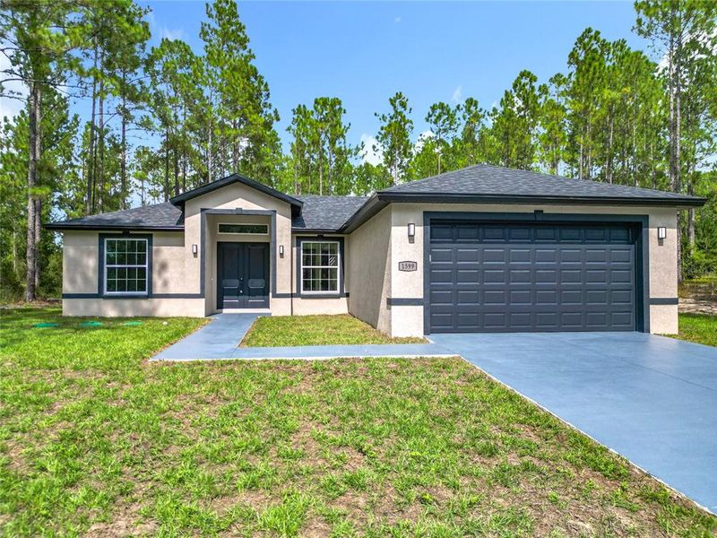 Front exterior of a new home in , Citrus Springs, FL, highlighting curb appeal (Image 20).