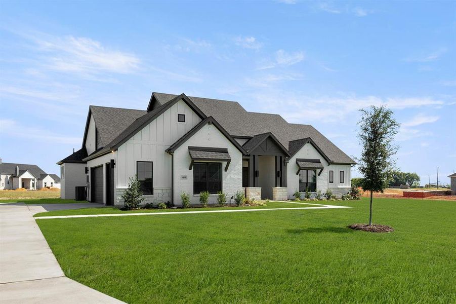Front exterior of a new home in Hartson Estates - 1 Acre Lots, Midlothian, TX, highlighting curb appeal (Image 1). Front exterior of a new home in Hartson Estates - 1 Acre Lots, Midlothian, TX, highlighting curb appeal (Image 1).