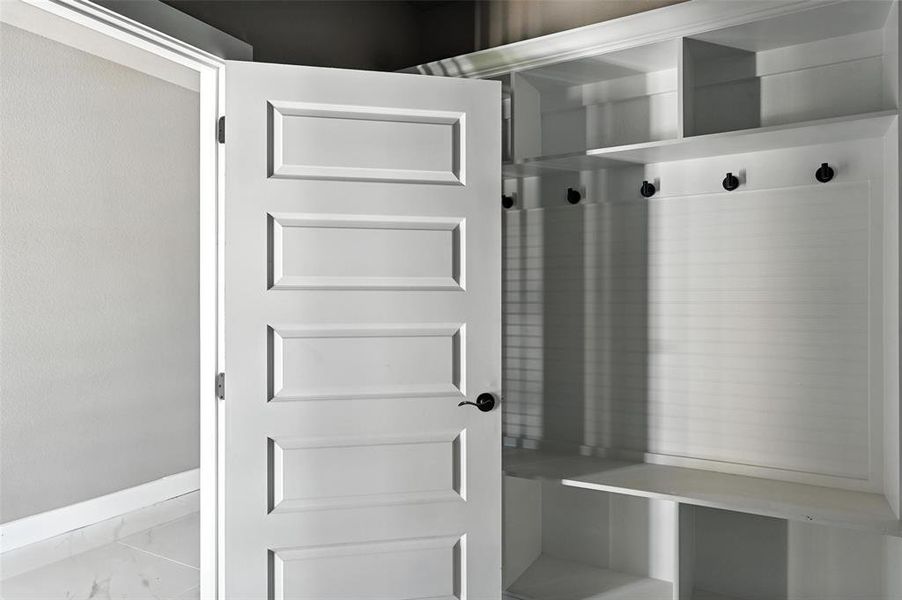 Mudroom featuring marble look tile flooring Mudroom featuring marble look tile flooring