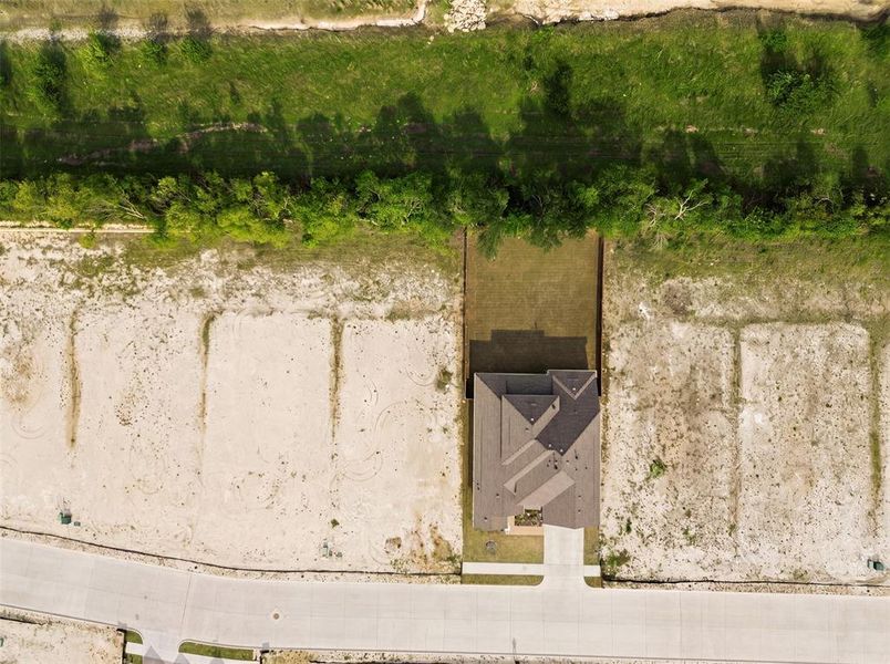 Single-story residence featuring a multi-gabled roofline and an attached concrete driveway