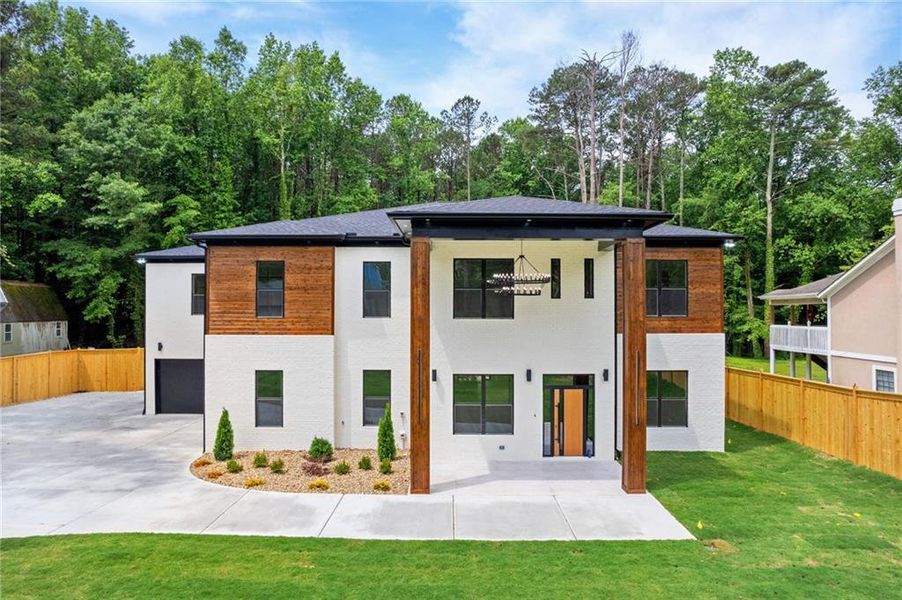 Front exterior of a new home in , Lilburn, GA, highlighting curb appeal (Image 34).