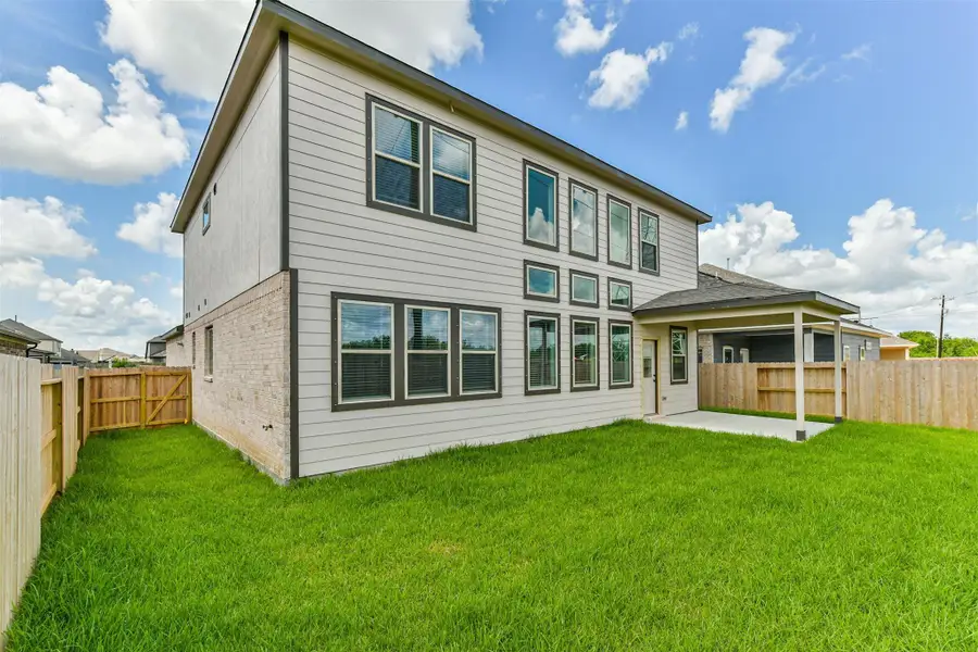 Front exterior of a new home in , Manvel, TX, highlighting curb appeal (Image 2). Front exterior of a new home in , Manvel, TX, highlighting curb appeal (Image 2).