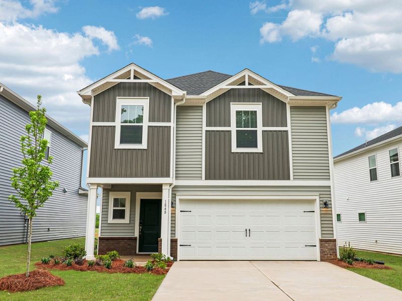 Front exterior of a new home in Trivium Meadows, Newton, NC, highlighting curb appeal (Image 1). Front exterior of a new home in Trivium Meadows, Newton, NC, highlighting curb appeal (Image 1).