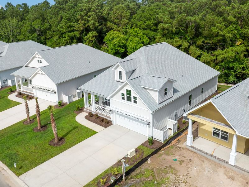 Front exterior of a new home in The Sanctuary at Sunset Beach, Sunset Beach, NC, highlighting curb appeal (Image 25).