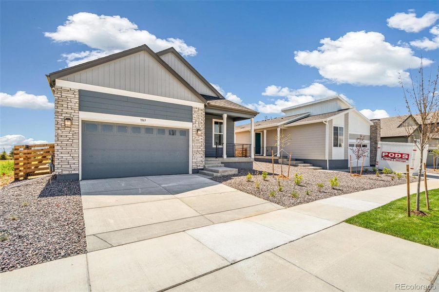 Front exterior of a new home in Legato, Commerce City, CO, highlighting curb appeal (Image 2).