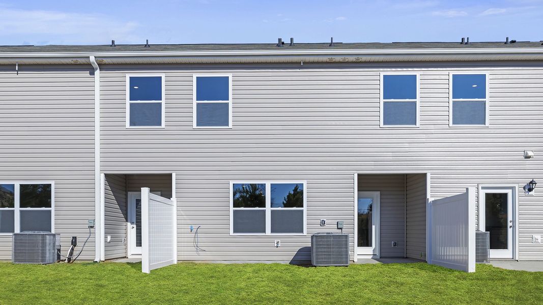 Exterior details and patio area of a home in Brookside Ridge Townhomes, Greer (Image 3).