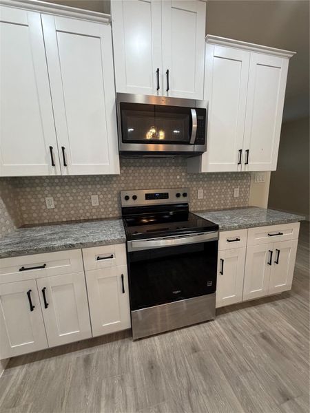 Furnished interior view inside a new home in , Conroe (Image 12).