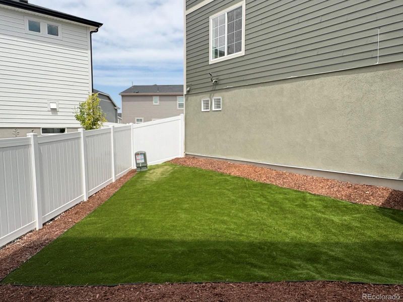 Front exterior of a new home in Green Valley Ranch, Aurora, CO, highlighting curb appeal (Image 22).