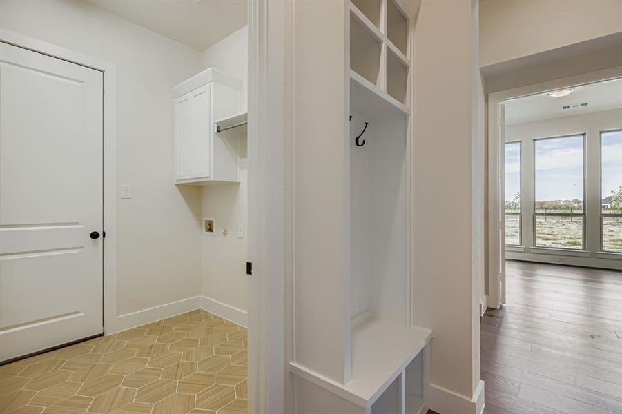 Mudroom featuring baseboards Mudroom featuring baseboards