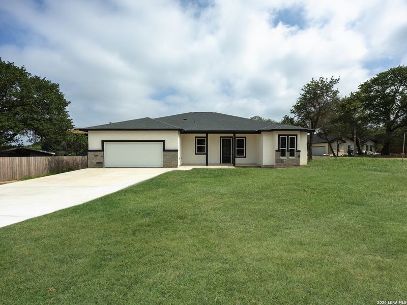 Front exterior of a new home in , Elmendorf, TX, highlighting curb appeal (Image 1). Front exterior of a new home in , Elmendorf, TX, highlighting curb appeal (Image 1).