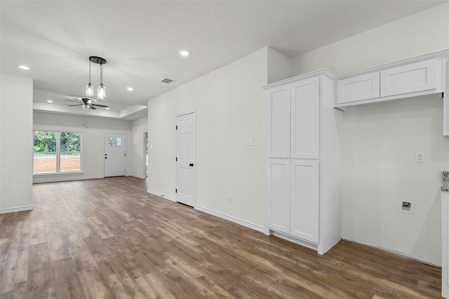 Unfurnished room featuring wood-type flooring and ceiling fan