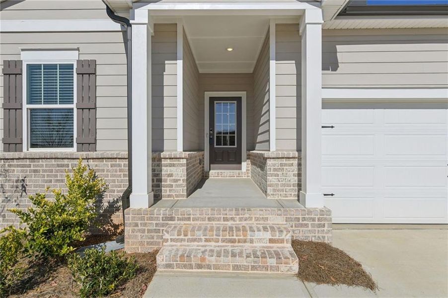 Exterior details and patio area of a home in Preserve at Mountain Creek, Pendergrass (Image 34).