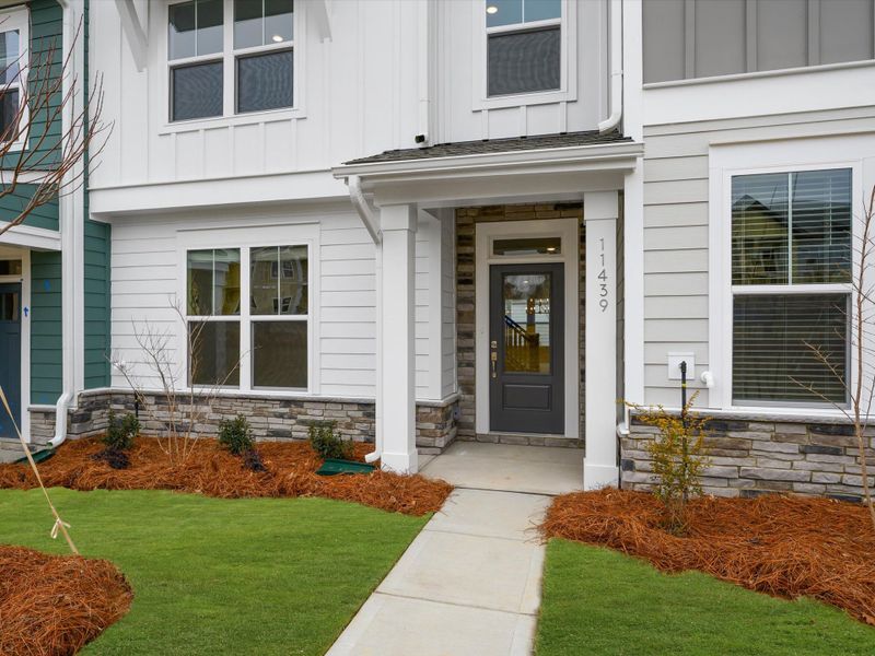 Exterior details and patio area of a home in North Creek Village - Townhomes, Huntersville (Image 21).