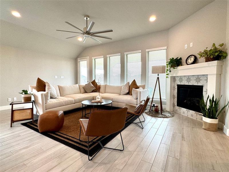 Family Room w/ wall of windows and gas fireplace