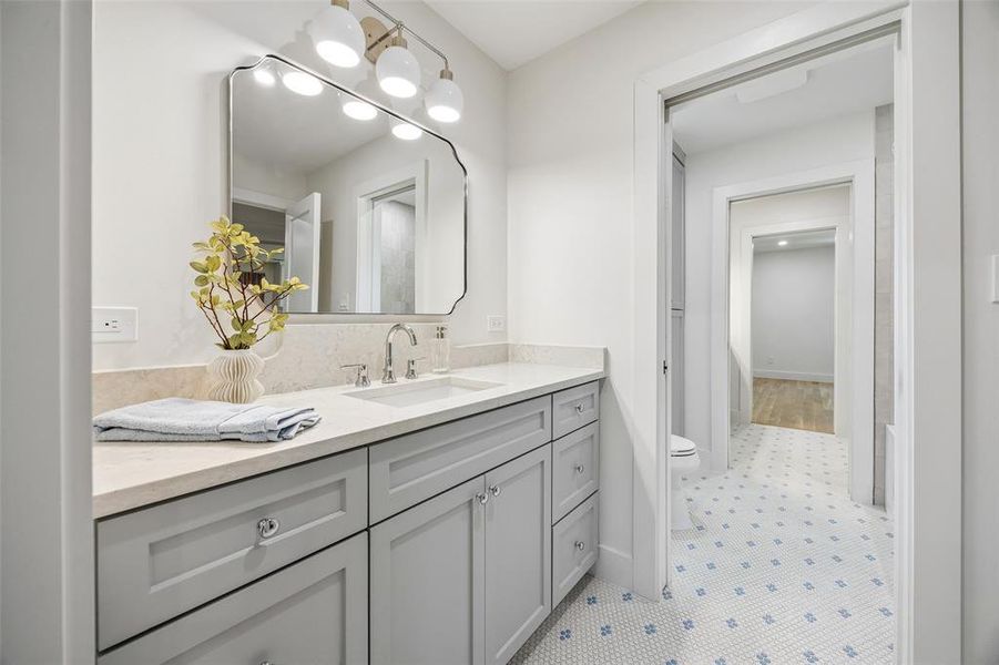 Jack and Jill style bathroom, with hand laid mosaic penny tile floor Jack and Jill style bathroom, with hand laid mosaic penny tile floor