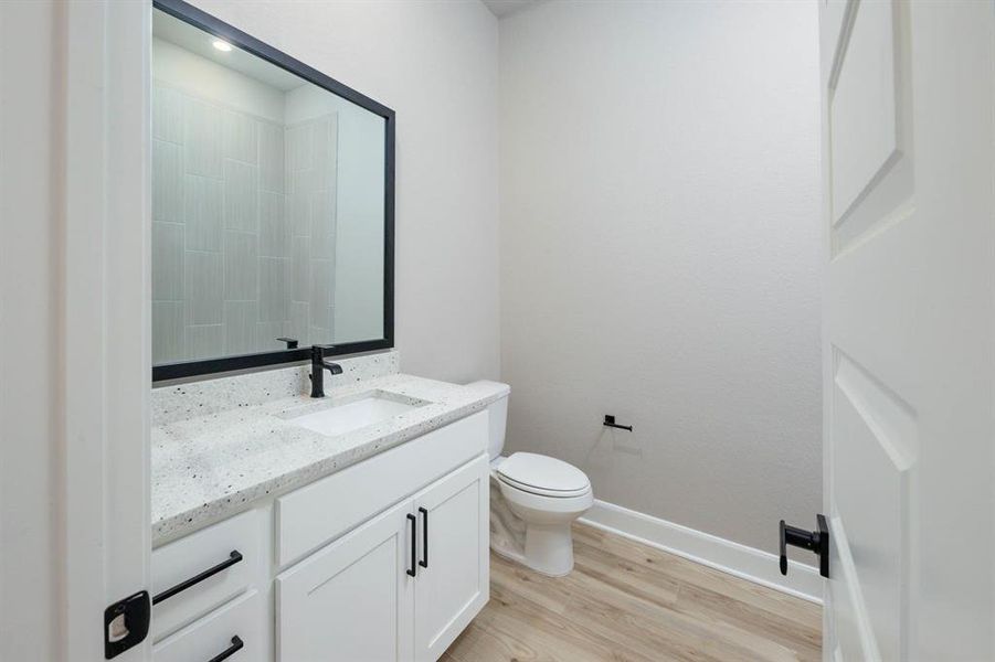 Each bathroom has expansive vanities offering an abundance of storage below.