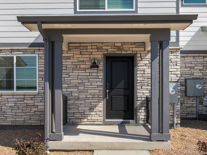 Front exterior of a new home in Skyview at High Point, Aurora, CO, highlighting curb appeal (Image 24).