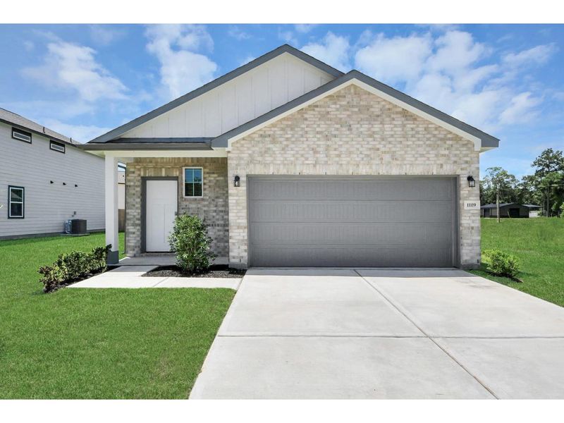 Front exterior of a new home in Liberty Estates, Cleveland, TX, highlighting curb appeal (Image 1). Front exterior of a new home in Liberty Estates, Cleveland, TX, highlighting curb appeal (Image 1).