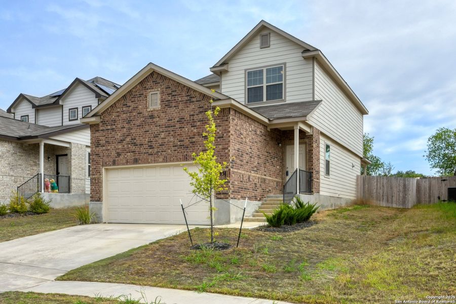 Front exterior of a new home in Somerset Trails, San Antonio, TX, highlighting curb appeal (Image 18).