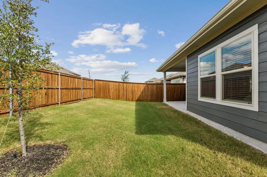 Exterior details and patio area of a home in Lakehaven - Spring Series, Farmersville (Image 4). Exterior details and patio area of a home in Lakehaven - Spring Series, Farmersville (Image 4).