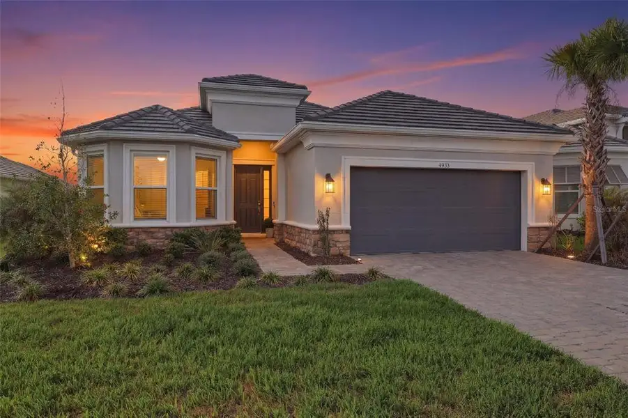 Front exterior of a new home in , Wesley Chapel, FL, highlighting curb appeal (Image 2). Front exterior of a new home in , Wesley Chapel, FL, highlighting curb appeal (Image 2).