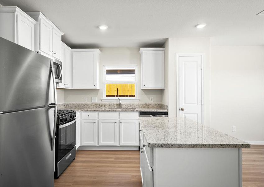 The kitchen features stainless-steel appliances.