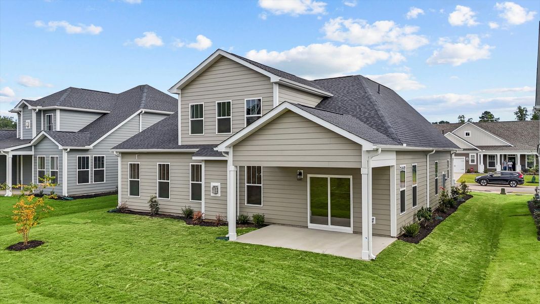 Superior curb appeal continues to the back with a refined, covered outdoor living space