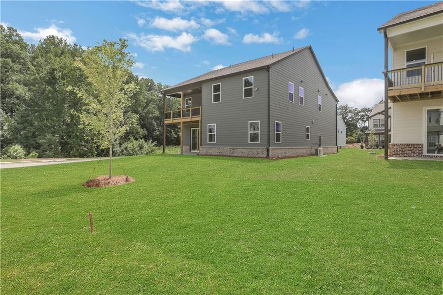 Exterior details and patio area of a home in The Paddocks at Doc Hughes, Buford (Image 3).