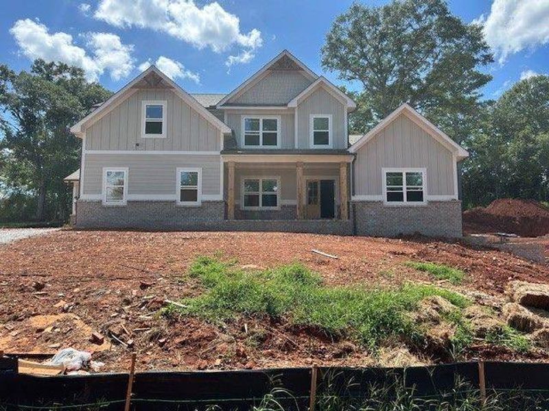 Exterior details and patio area of a home in Steeplechase, Hoschton (Image 1).