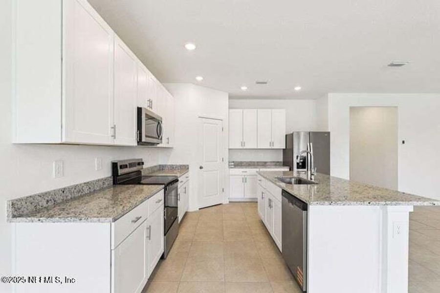 Furnished interior view inside a new home in Lakes at Bella Lago - Signature Series, Green Cove Springs (Image 8). Furnished interior view inside a new home in Lakes at Bella Lago - Signature Series, Green Cove Springs (Image 8).