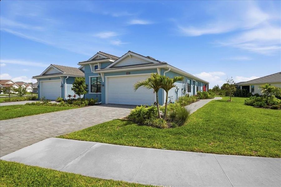 Front exterior of a new home in , Venice, FL, highlighting curb appeal (Image 22).