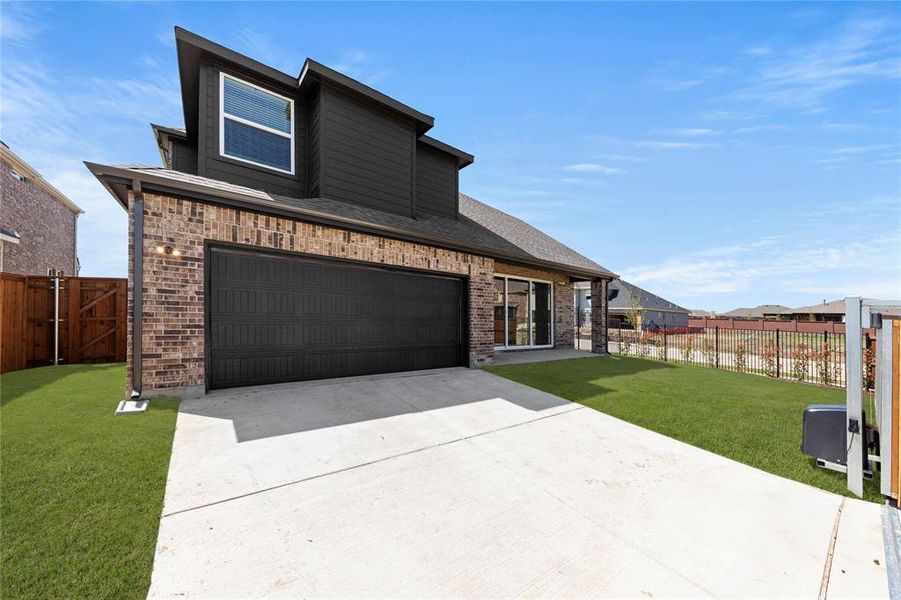 Front exterior of a new home in Villages of Creekwood, Frisco, TX, highlighting curb appeal (Image 2). Front exterior of a new home in Villages of Creekwood, Frisco, TX, highlighting curb appeal (Image 2).
