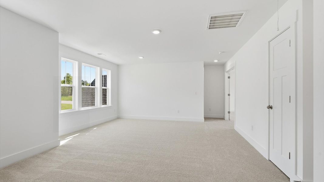 Refined loft with comfortable carpeted flooring and tasteful design throughout in Woodruff, SC