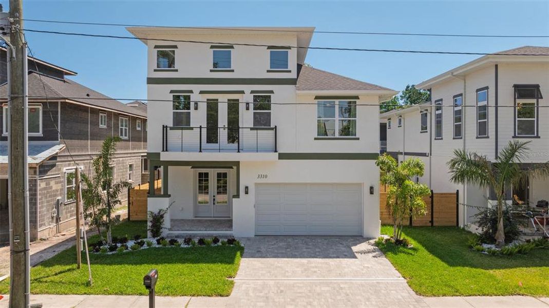 Front exterior of a new home in Wyoming Estates, Tampa, FL, highlighting curb appeal (Image 21). Front exterior of a new home in Wyoming Estates, Tampa, FL, highlighting curb appeal (Image 21).