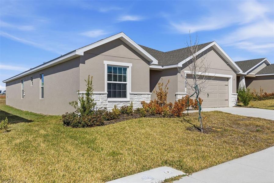 Front exterior of a new home in , Davenport, FL, highlighting curb appeal (Image 28).
