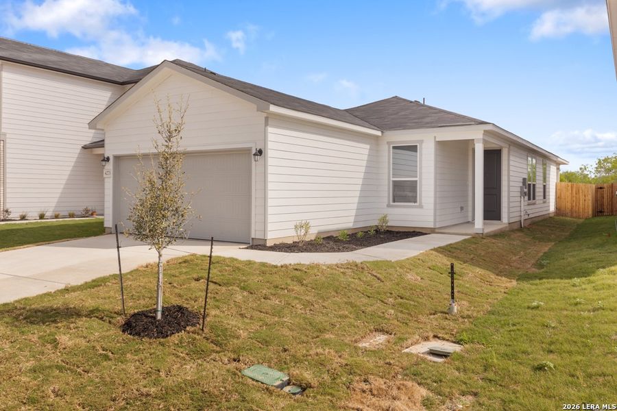Front exterior of a new home in Legend Heights, New Braunfels, TX, highlighting curb appeal (Image 16).