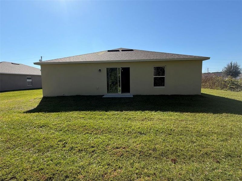 Exterior details and patio area of a home in Poinciana - Polk County, Poinciana (Image 2).