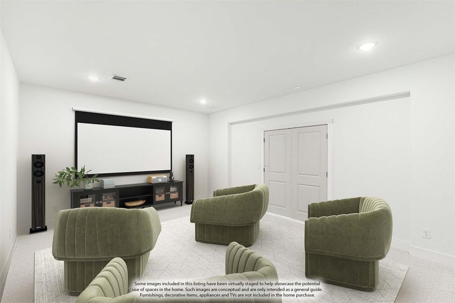 Media room with large projection screen, floor speakers, and green upholstered seating arranged on carpet