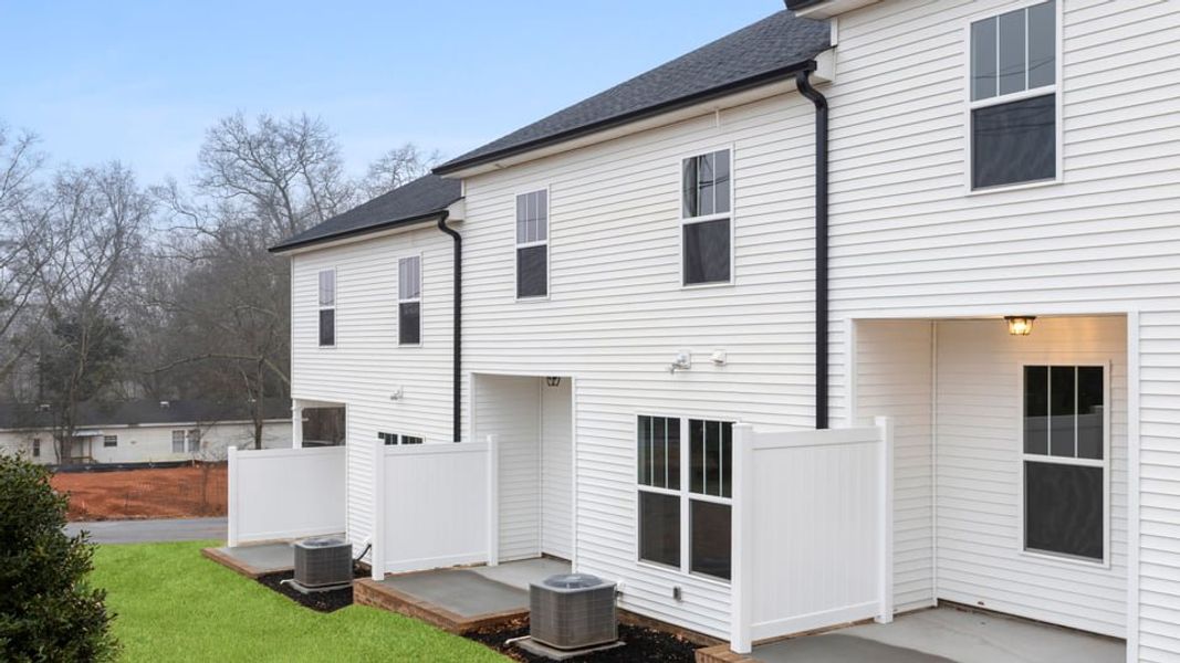 Exterior details and patio area of a home in Pearson Road Townhomes, Easley (Image 19).