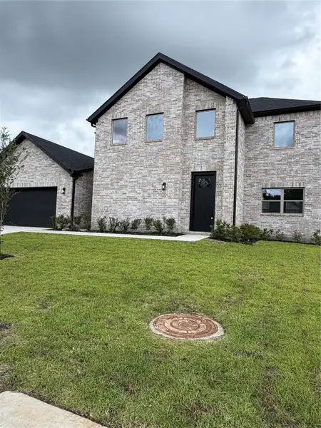 Front exterior of a new home in , Spring, TX, highlighting curb appeal (Image 18).