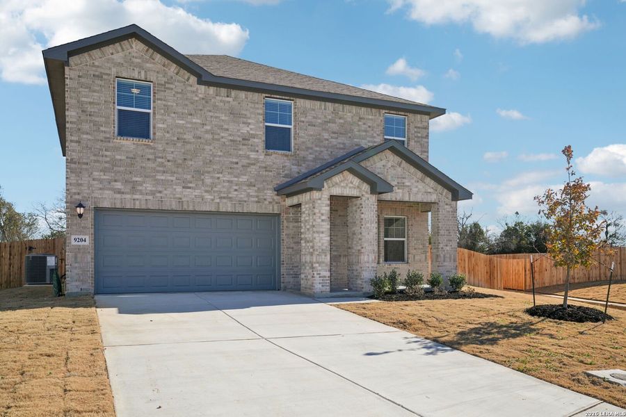 Front exterior of a new home in Carmel Ranch, Schertz, TX, highlighting curb appeal (Image 20).