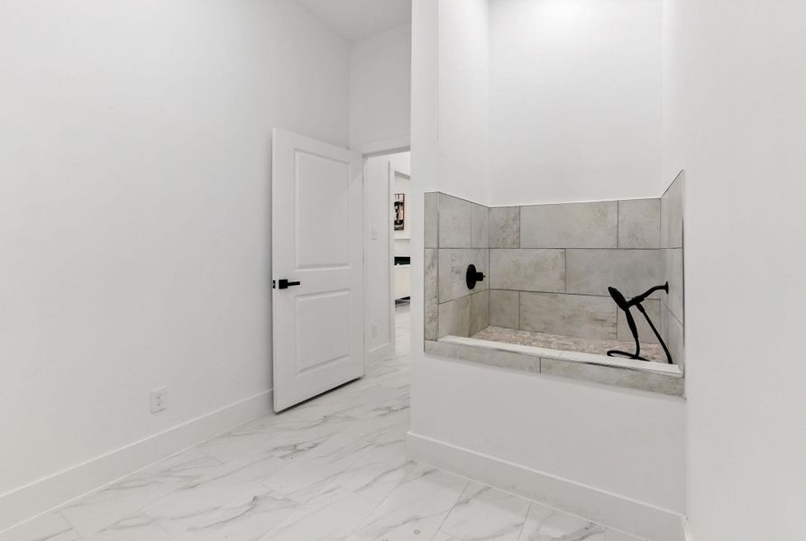 A built-in pet shower station designed for convenient at-home grooming