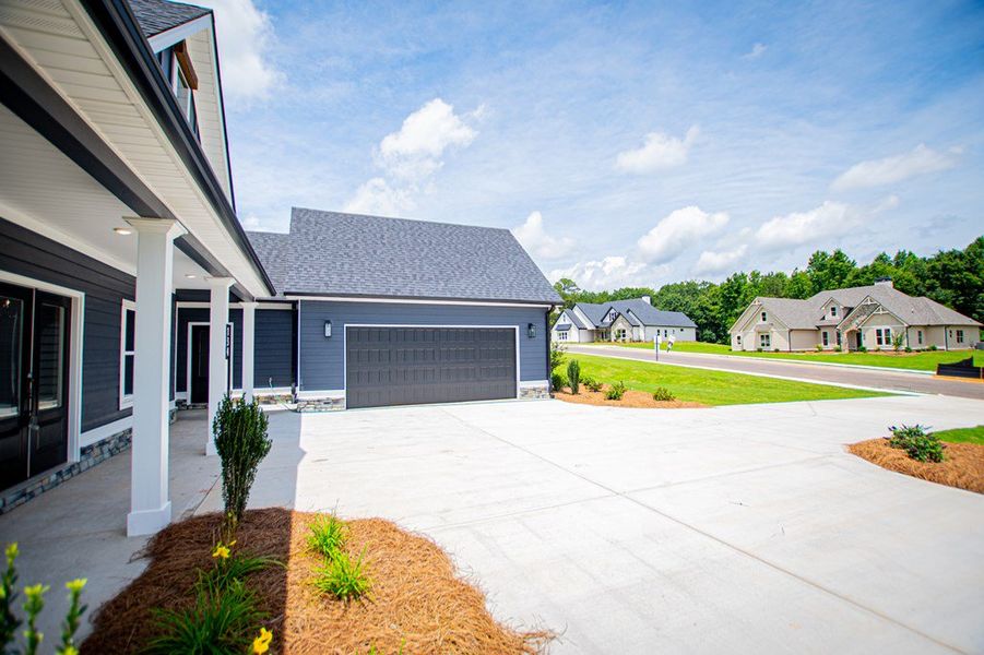 Exterior details and patio area of a home in WOODMONT RESERVE, Roopville (Image 4).