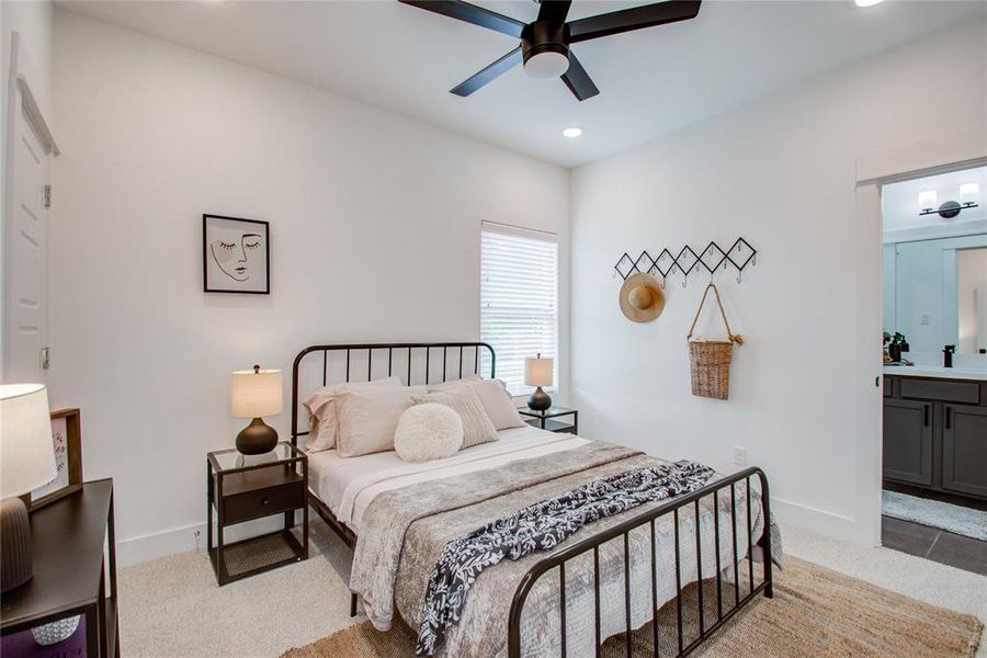 Secondary bedroom with access to the J&J bathroom. Model home photos - FINISHES AND LAYOUT MAY VARY! Ceiling fans are NOT INCLUDED!