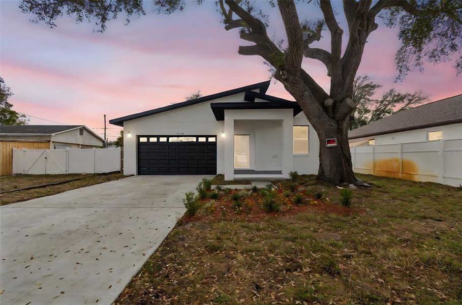 Front exterior of a new home in , Pinellas Park, FL, highlighting curb appeal (Image 20).