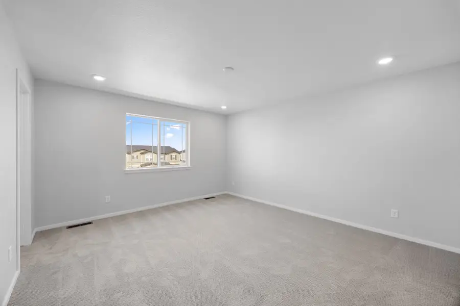 Spacious, unfurnished interior of a new home in Sky Ranch, Watkins (Image 22).